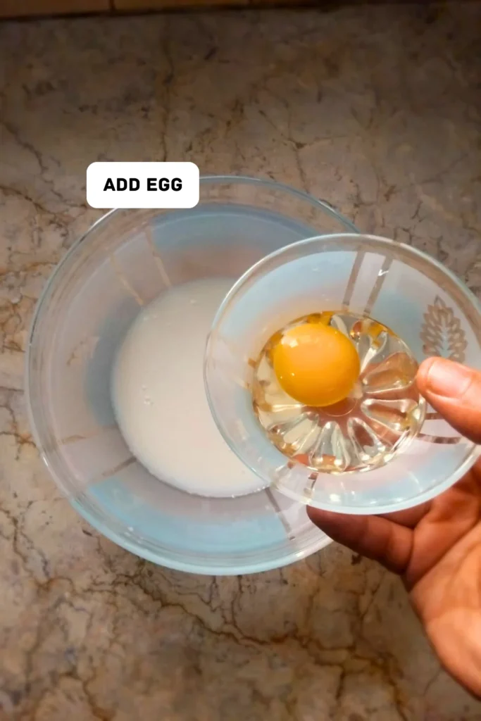 Add egg in muffin paste Add egg in muffin paste